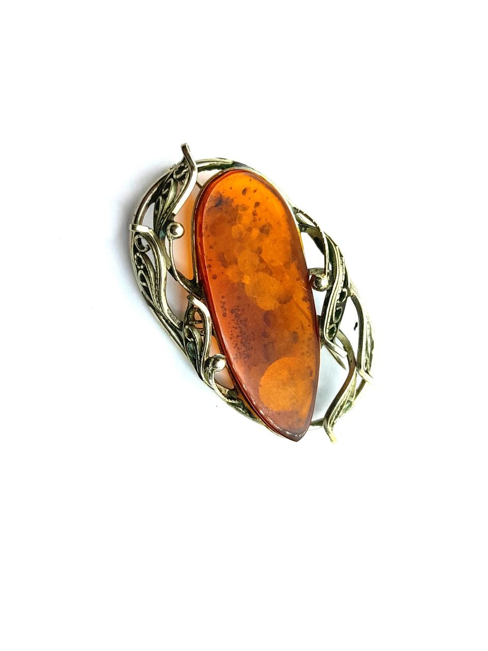 Silver and amber brooch
